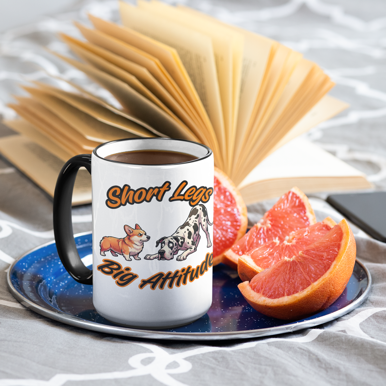 Mug with dog design and text on a saucer with fruit and phone, on a textured surface